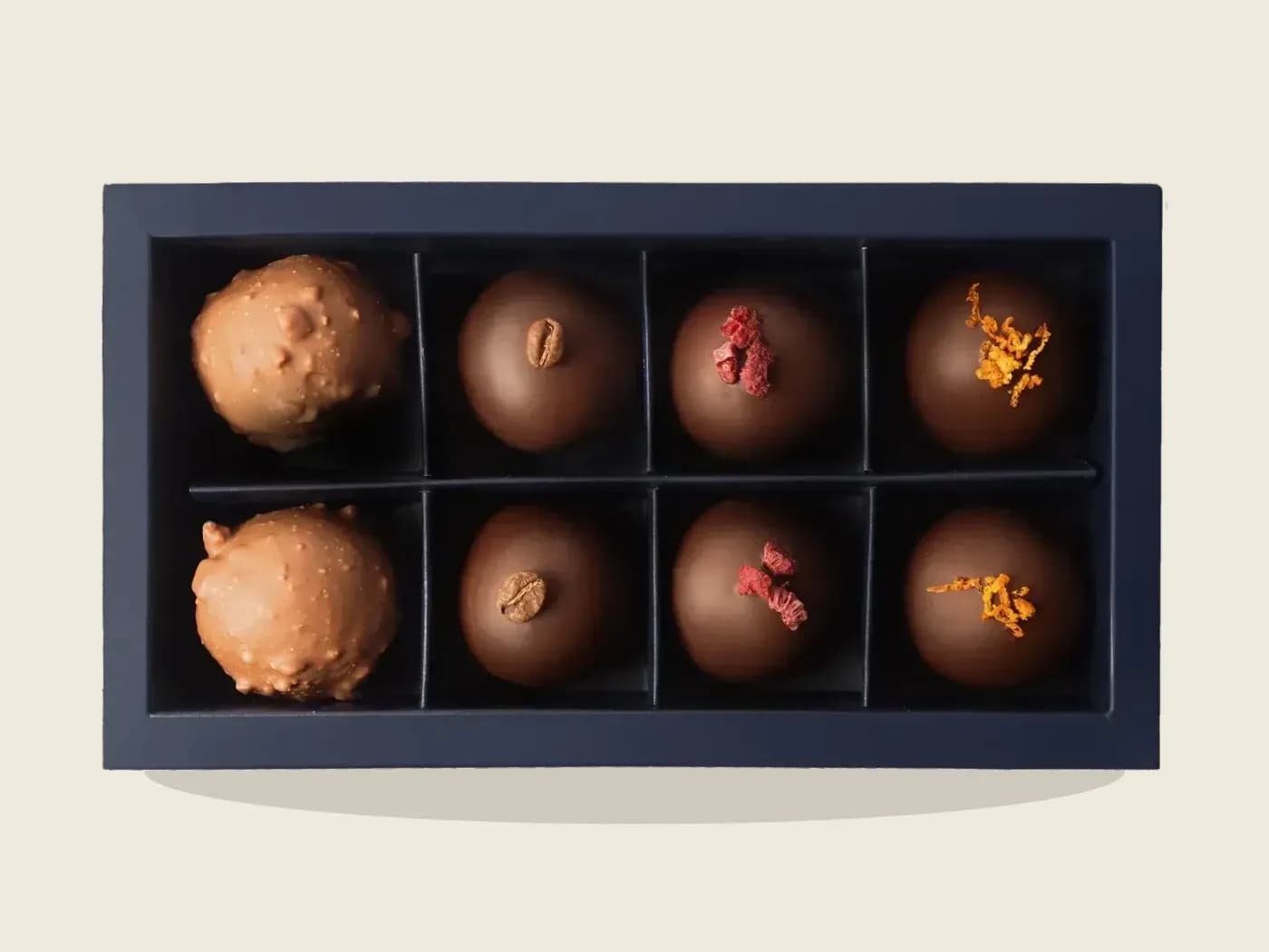 The box of 8, open, seen from above.