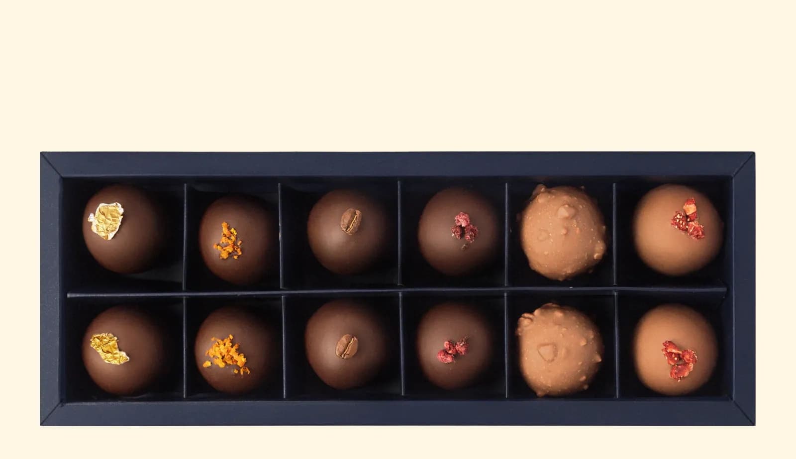 The box of twelve, open: six flavours, two of each.